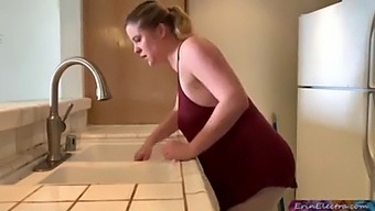 A Mature Woman And A Young Boy Engage In Intimate Activities In The Kitchen